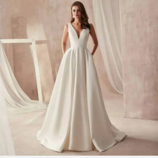 Vestido de novia corte A Clásico con bolsillos laterales en satín