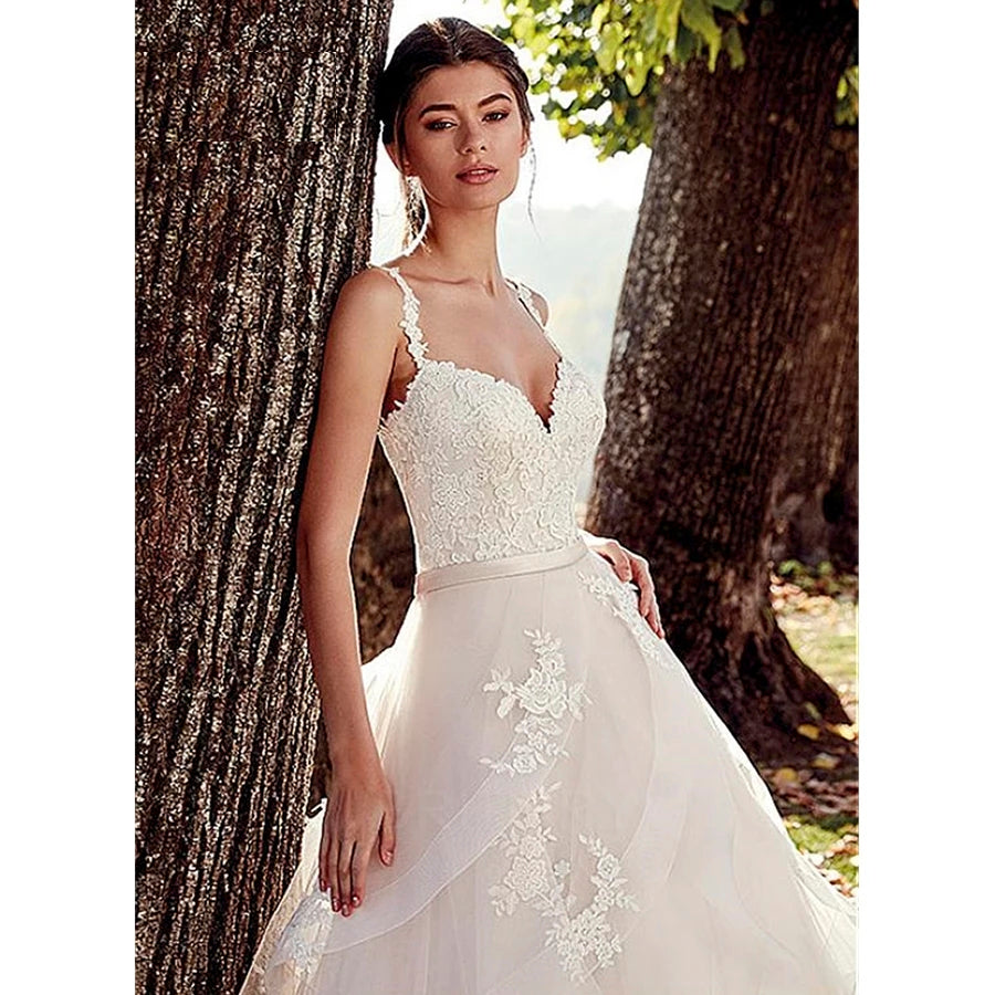 Vestido de novia de tirantes con olanes