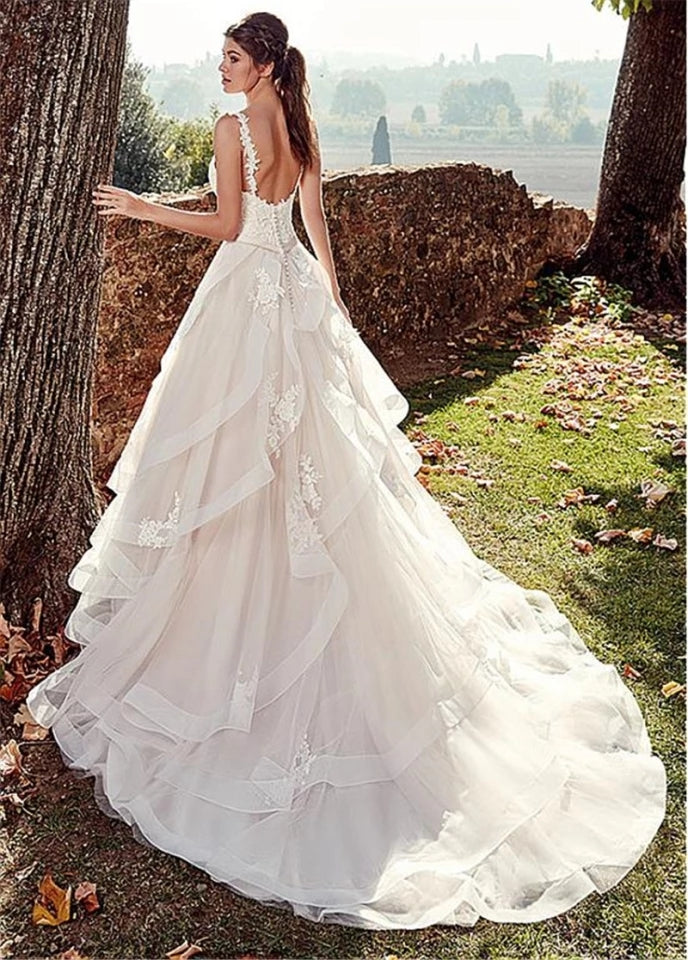 Vestido de novia de tirantes con olanes