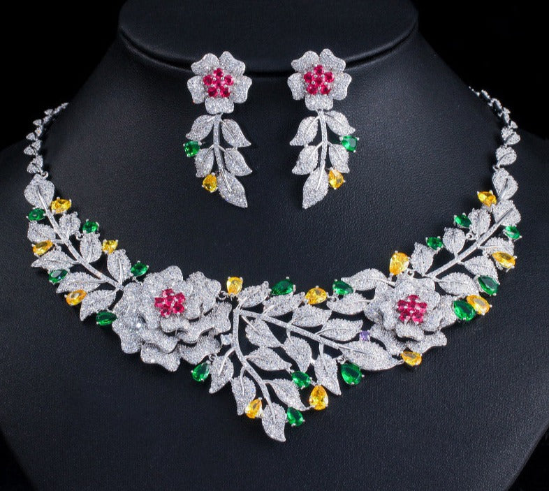 Hermoso conjunto de joyería para novias en flores y pétalos de color