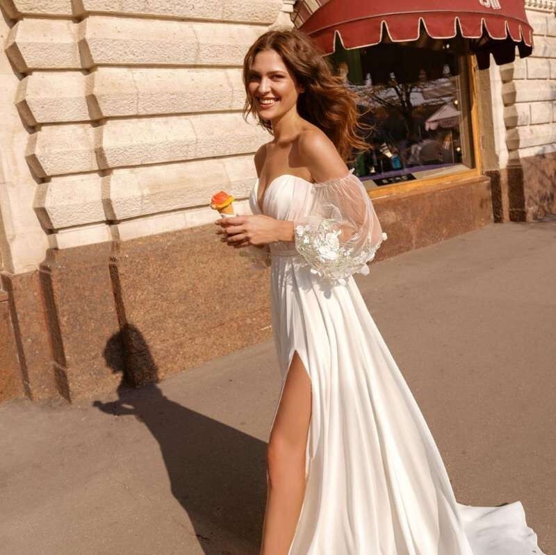 Vestido de novia de gasa de encaje con mangas abullonadas