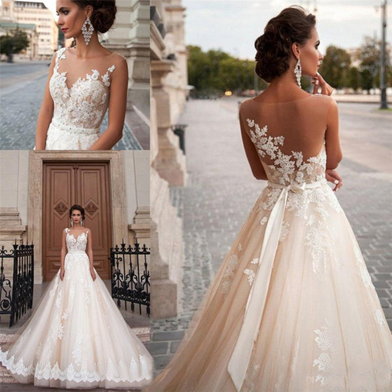 Vestido de novia corte princesa con lazo largo, apliques y mesh ilusión