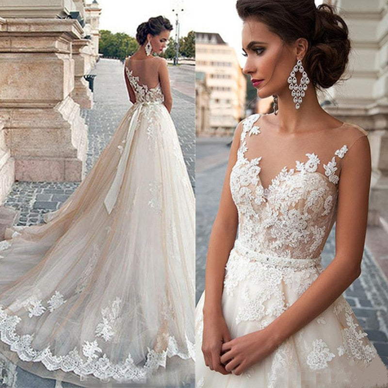 Vestido de novia corte princesa con lazo largo, apliques y mesh ilusión